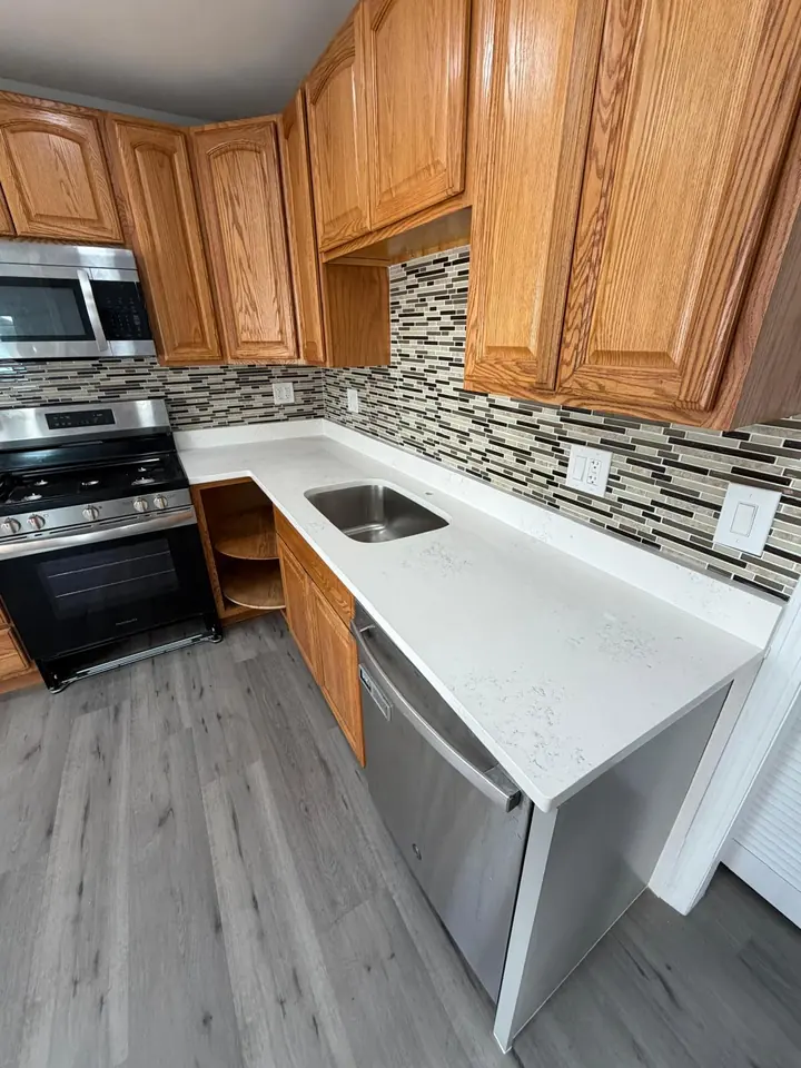 Kitchen with new gray vinyl plank flooring