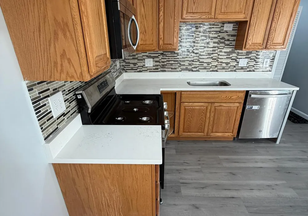 Kitchen cabinets and vinyl flooring project in Massachusetts by WD Art Painting
