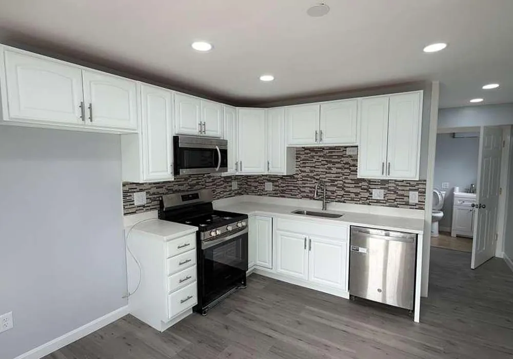 Kitchen cabinets and vinyl flooring project in Massachusetts by WD Art Painting